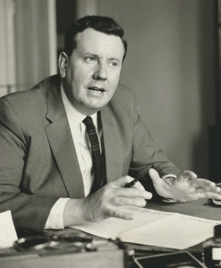 Malcolm Arnold poses with a score [n.d.].